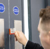 Global Facilities Fire Door Inspector carrying out a fire door gap inspection.