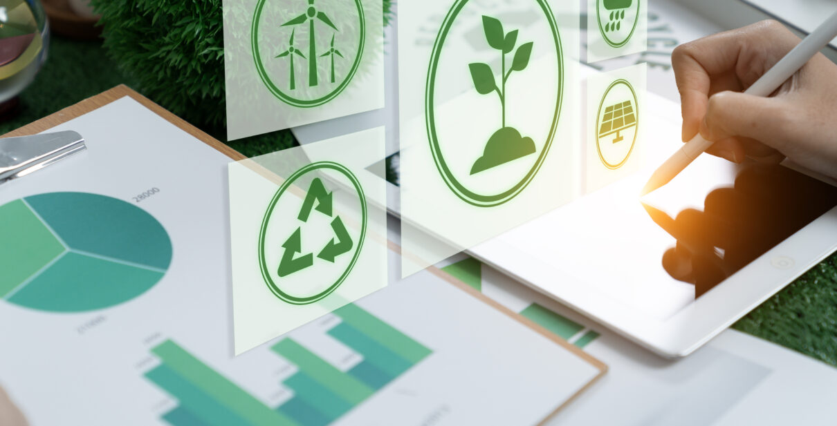 Businesswomen use a digital tablet to analyze ESG design.