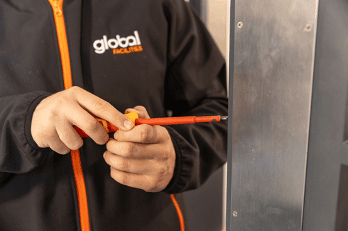 Performing fire door maintenance with a screwdriver
